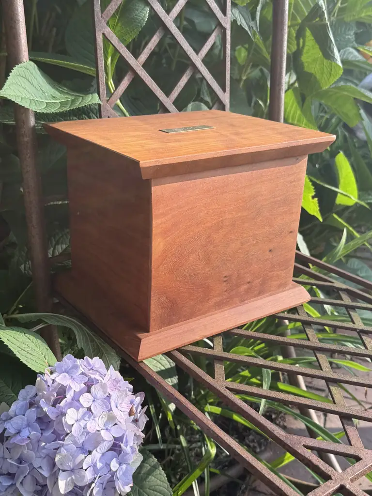 Handmade cherry wood urn with a lifting lid, built in Baltimore by Tyler Jones